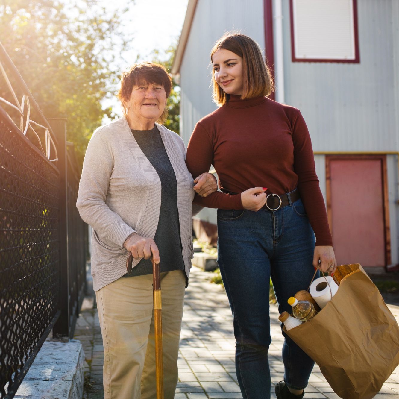 a home care person helping old lady