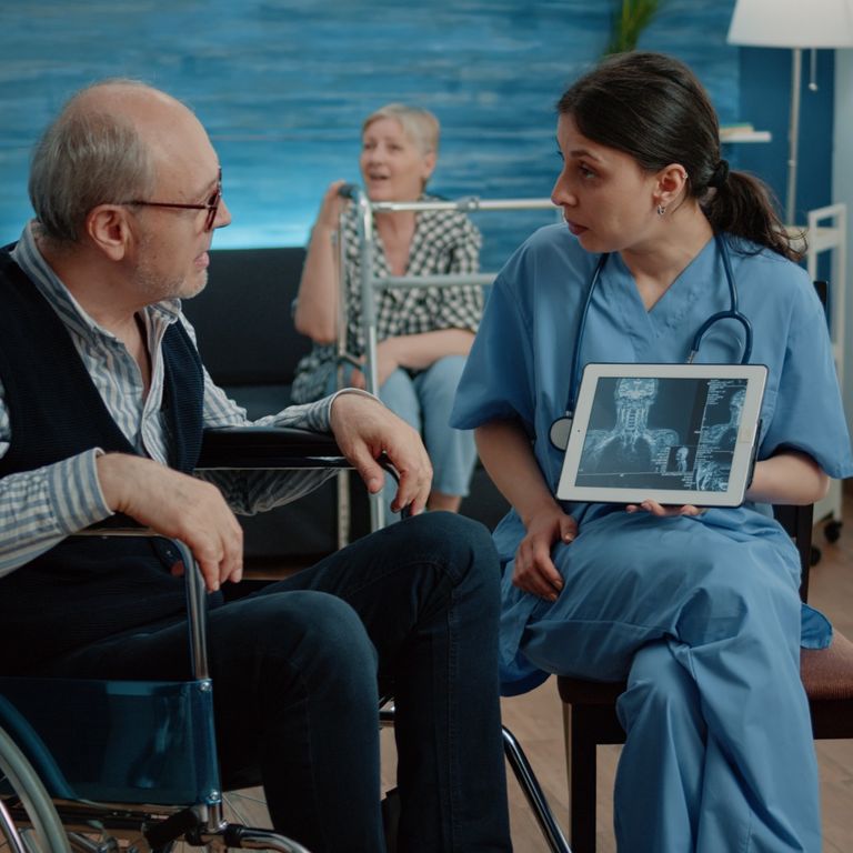 a home care person helping old lady